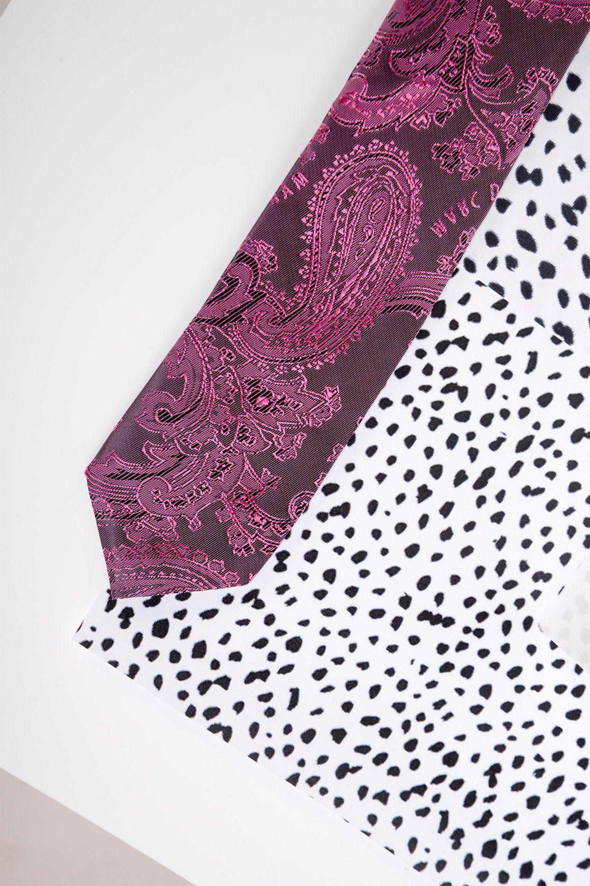 The Marc Darcy Children's Berry Paisley Print Tie features a vibrant paisley design over white fabric with black spots and includes an adjustable elasticated neck strap for added comfort.