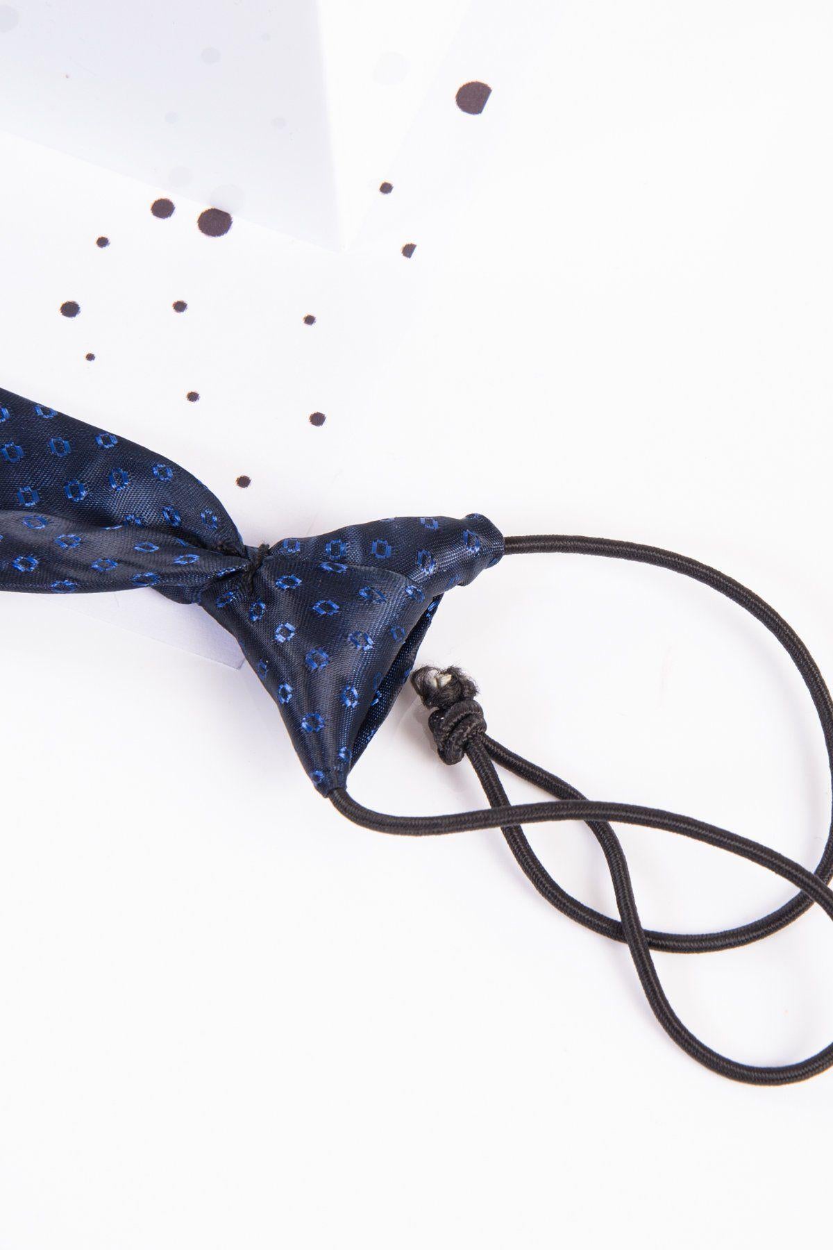 The Marc Darcy Childrens Navy Spot Print Tie features an adjustable neck strap for comfort and style. Displayed on a white surface with black dots, this tie is perfect for a formal look.
