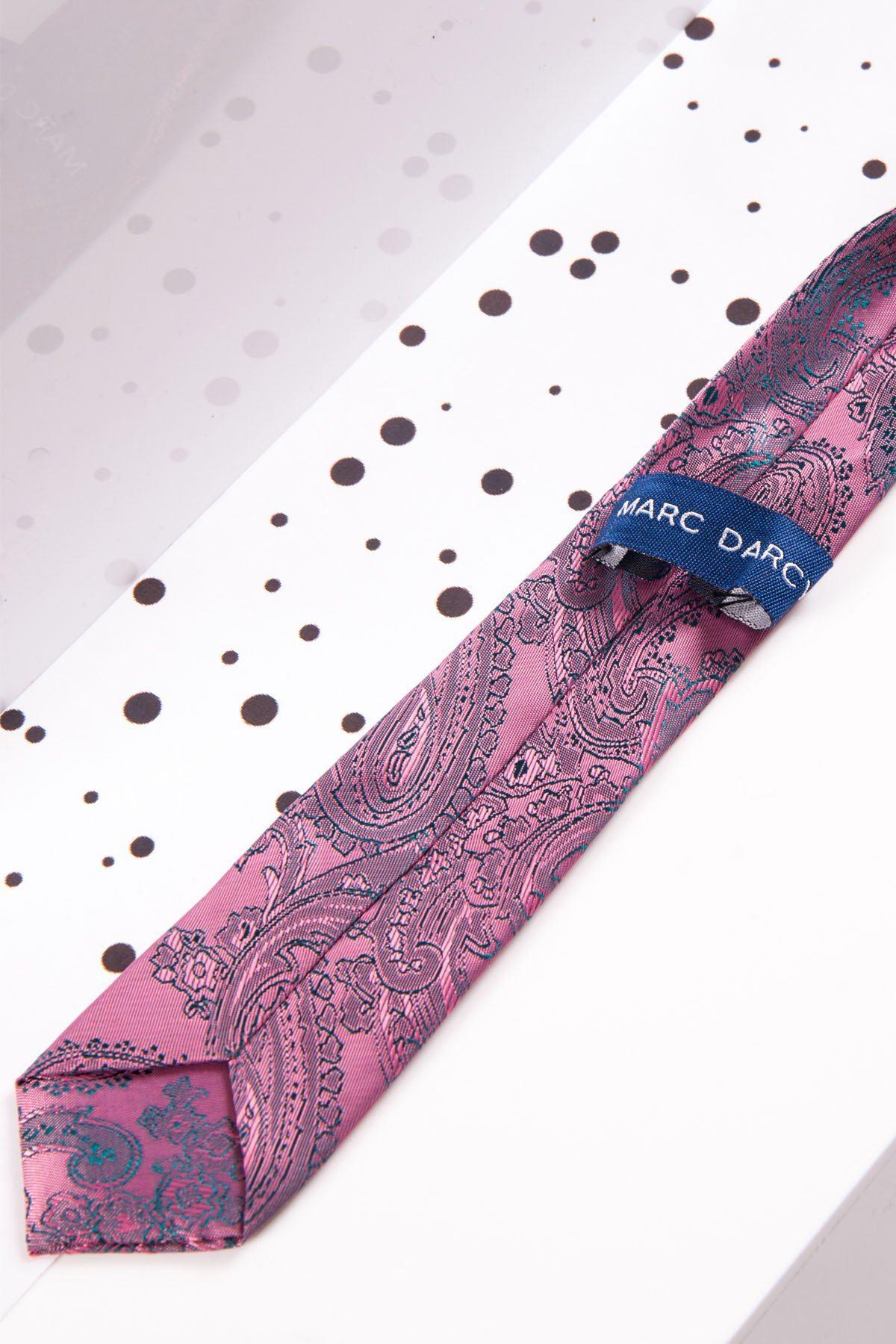 The Childrens Pink Paisley Print Tie by Marc Darcy is shown diagonally on a white background with black dots, ideal for formal outfits or page boy suits.