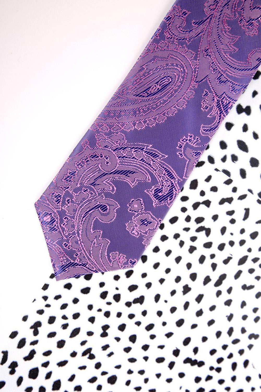 The Marc Darcy Children's Purple Paisley Print Tie features pink accents, an adjustable neck strap for a perfect fit, and is ideal for boys' formal wear.