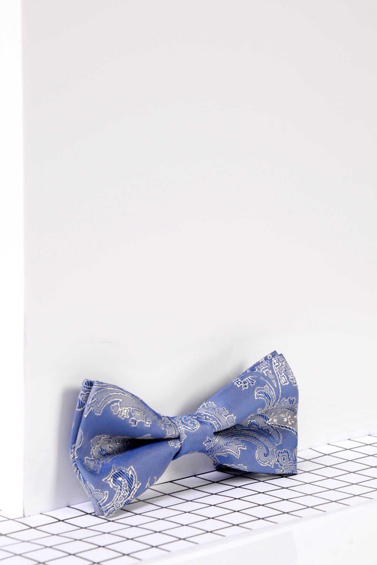 The Marc Darcy Children's Sky Blue Paisley Print Bow Tie, pre-tied and set against a white surface on a black and white checkered grid, is a stylish formal accessory perfect for any special occasion.