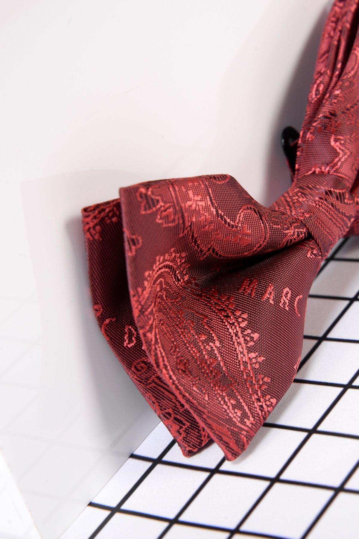 A close-up displays the Marc Darcy Children's Wine Paisley Print Bow Tie with a subtle sheen and neat knot—ideal for kids' formal wear or as a page boy bow tie at special occasions.