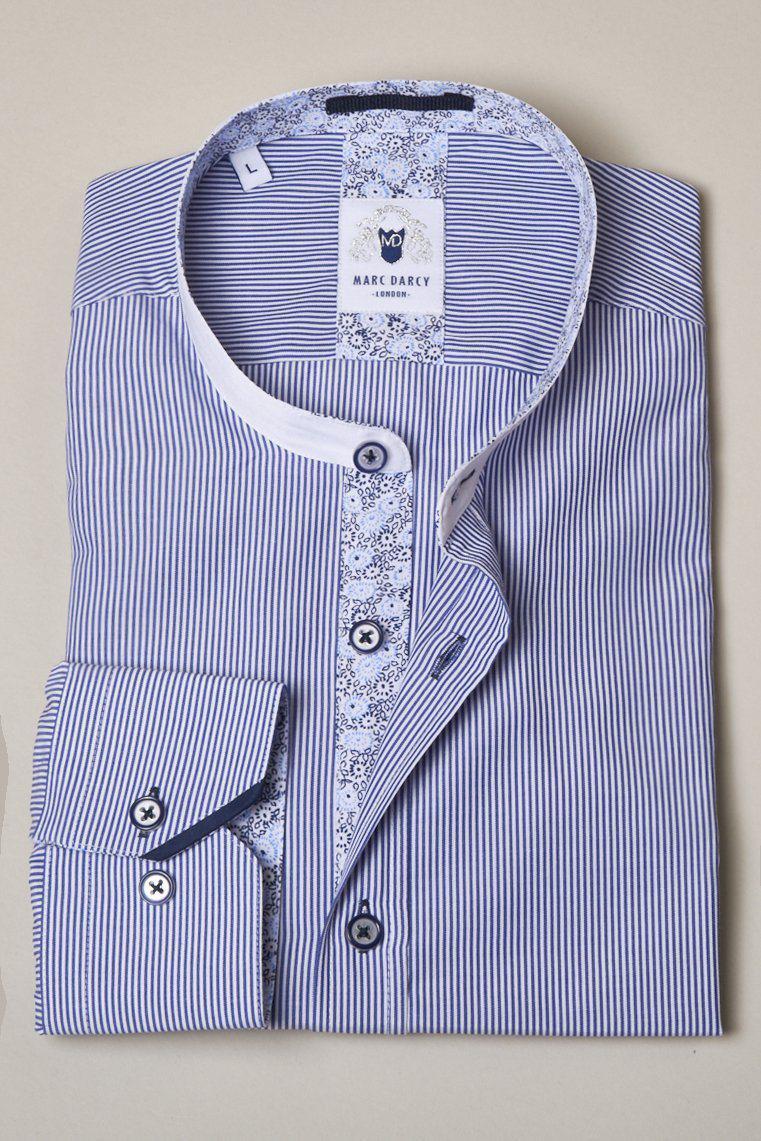The Marc Darcy COOPER Grandad Collar Navy Stripe Shirt features blue and white pinstripes, floral inner collar and placket details, buttoned cuffs, and is displayed on a beige background.