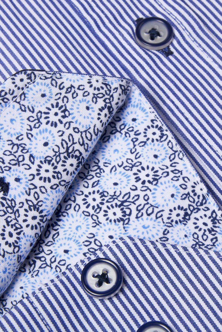 Close-up of the Marc Darcy COOPER Grandad Collar Navy Stripe Shirt, featuring vintage-inspired blue and white pinstripes, dark buttons, a grandad collar, and turned-back cuffs revealing contrasting blue floral fabric.