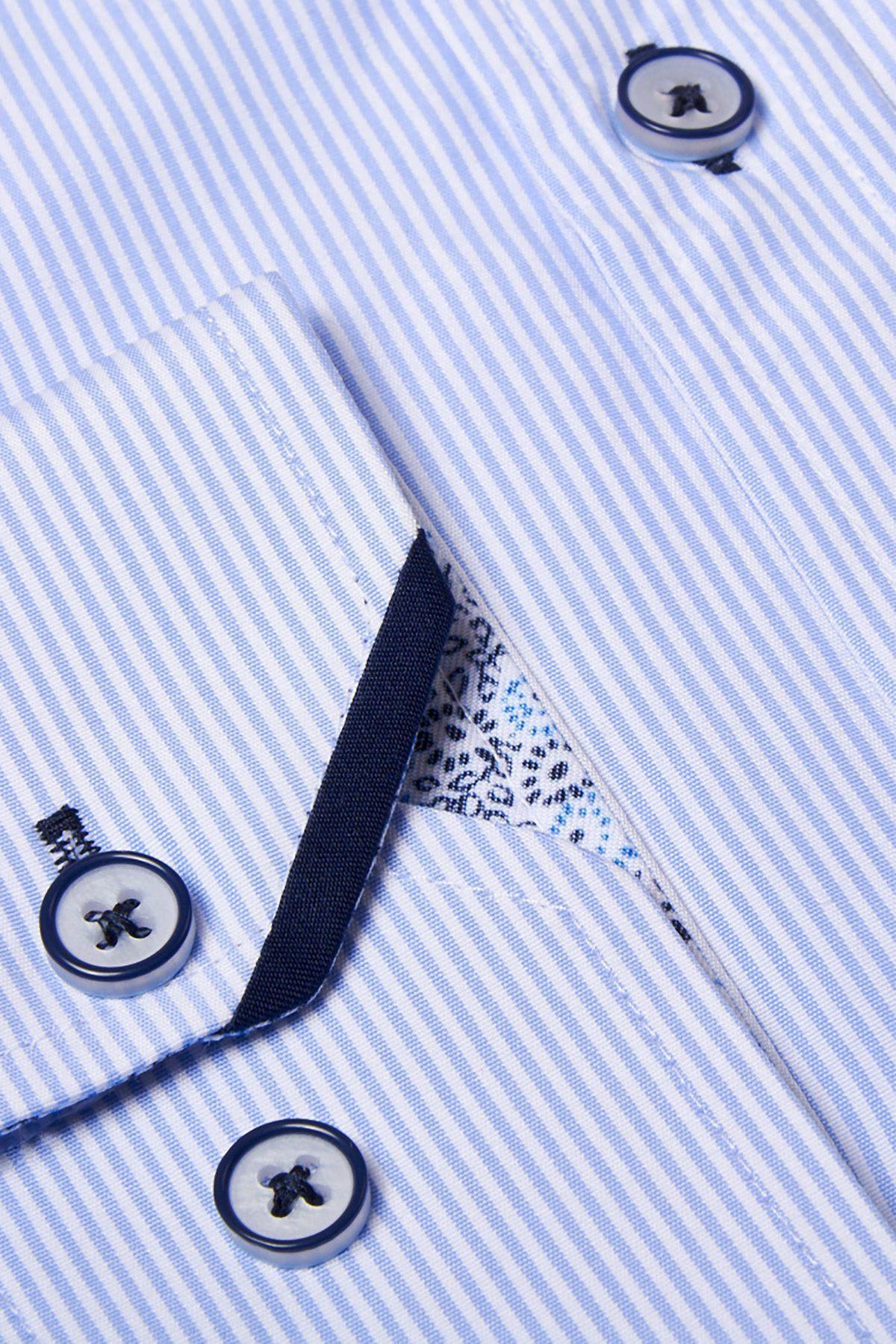 Close-up of the Marc Darcy COOPER Grandad Collar Sky Blue Stripe Shirt, featuring a light blue and white pinstripe design, dark buttons, and patterned inner placket detail.