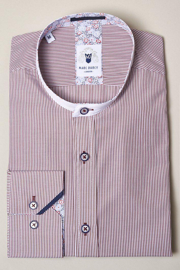 The COOPER Grandad Collar Wine Stripe Shirt by Marc Darcy features thin red and white pinstripes, long sleeves, a vintage-inspired grandad collar with floral inner detail, contrasting buttons, and a visible Marc Darcy label.