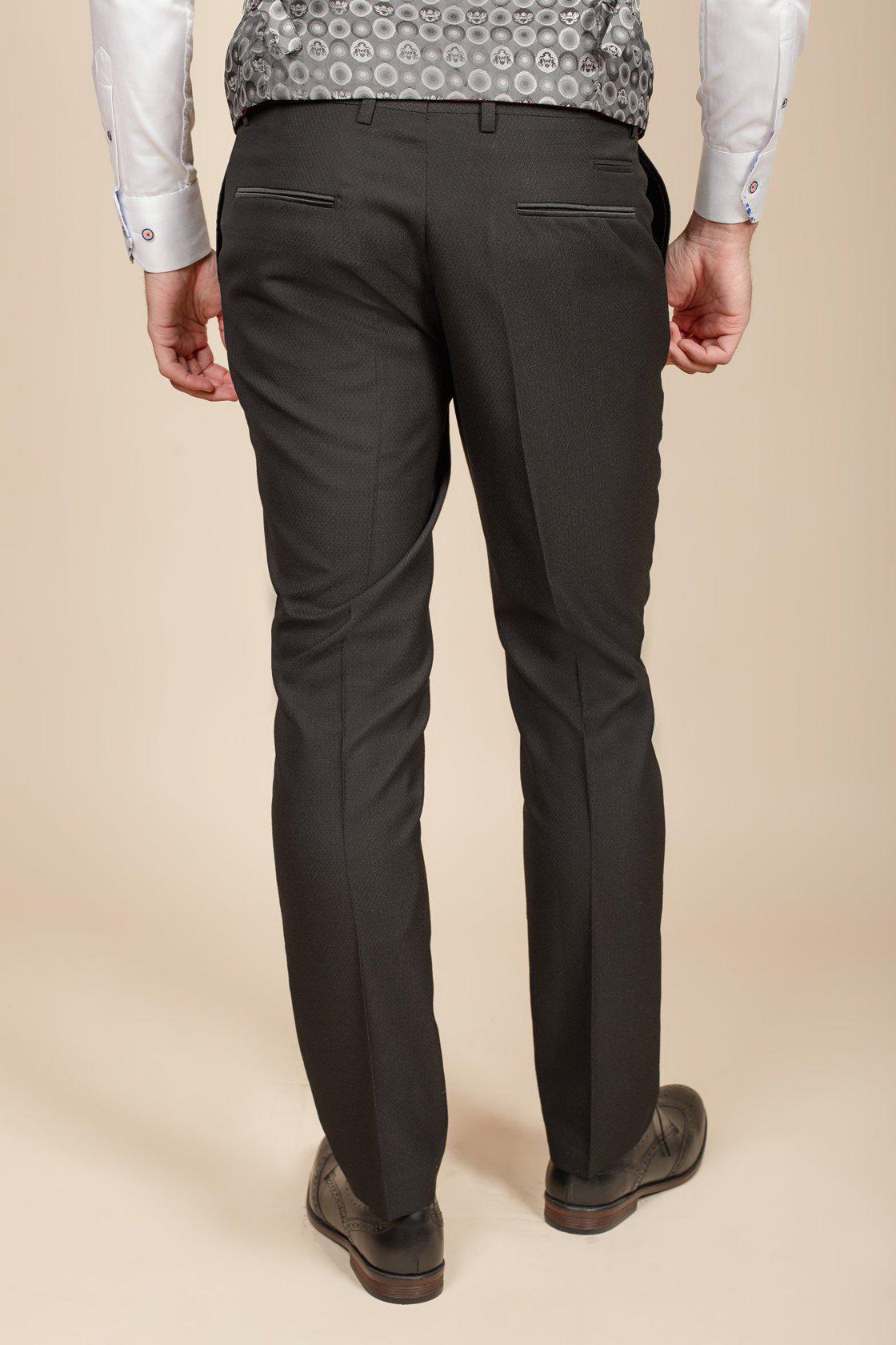 I’m A Celebrity Get Me Out Of Here 2022 runner-up Owen Warner is seen from behind in the marcdarcy Dalton Black Tuxedo—an elegant choice for black tie occasions.