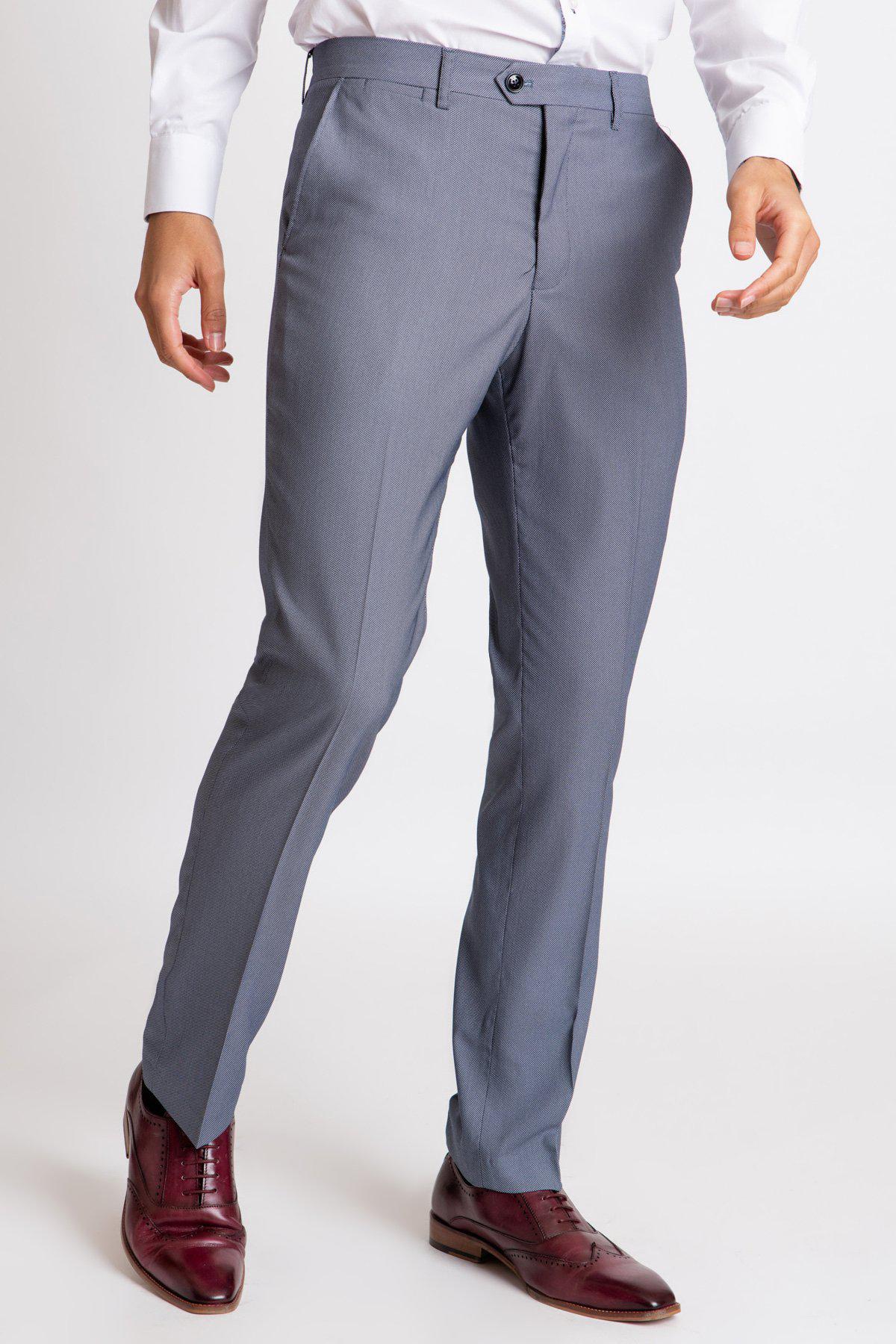 A person wearing a white dress shirt, Marc Darcy DANNY blue grey tailored trousers, and burgundy dress shoes stands against a plain white background.