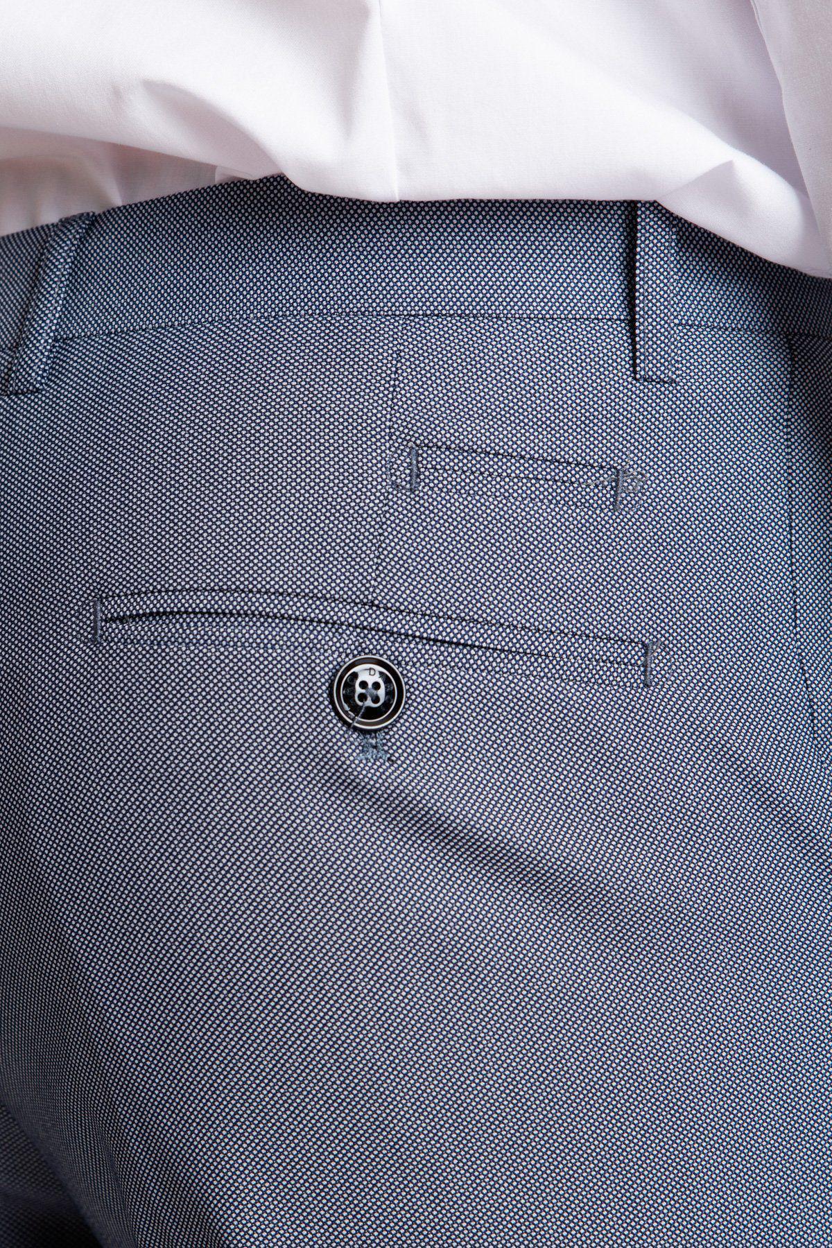 Close-up of the back pocket of Marc Darcy’s DANNY Blue Grey Tailored Trousers with a black button, styled with a white shirt tucked in—a smart workwear staple.