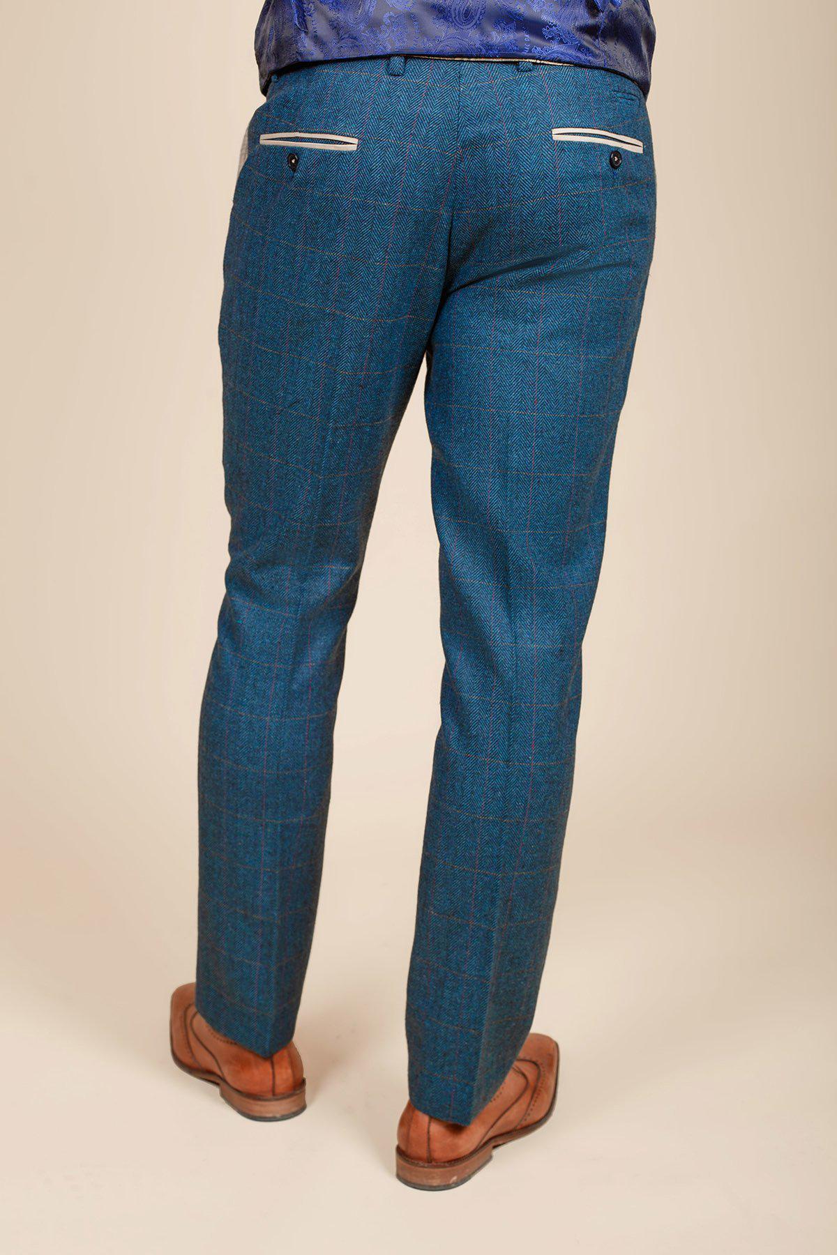 Someone is shown from the back against a neutral background wearing the marcdarcy DION - Blue Tweed Check Suit with a Kelvin Cream Waistcoat, featuring subtle checks and white-trimmed pockets, paired with brown dress shoes.