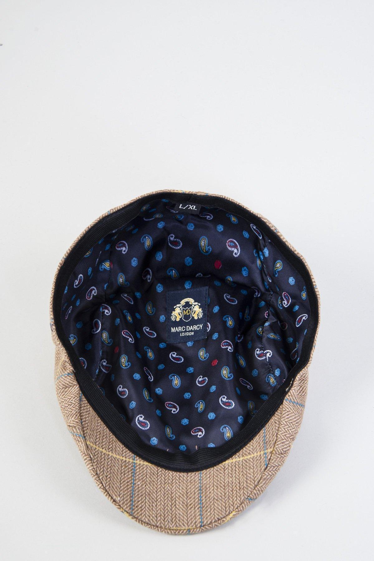 The DX7 - Oak Tweed Check Flat Cap by Accessory, when turned inside out, reveals its vintage style with a dark blue lining, a colorful paisley pattern, and a Marc Darcy logo label stitched inside.