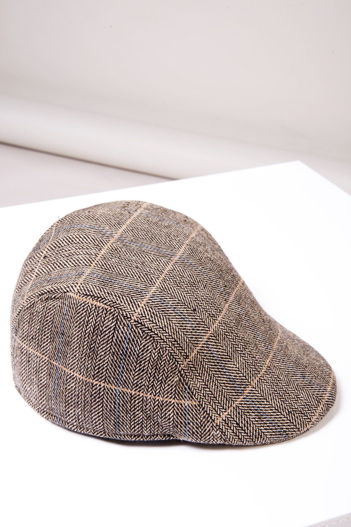 The Accessory TED - Tan Tweed Check Flat Cap features a classic herringbone pattern and is displayed on a white surface with a neutral background, making it an ideal men's formal hat.