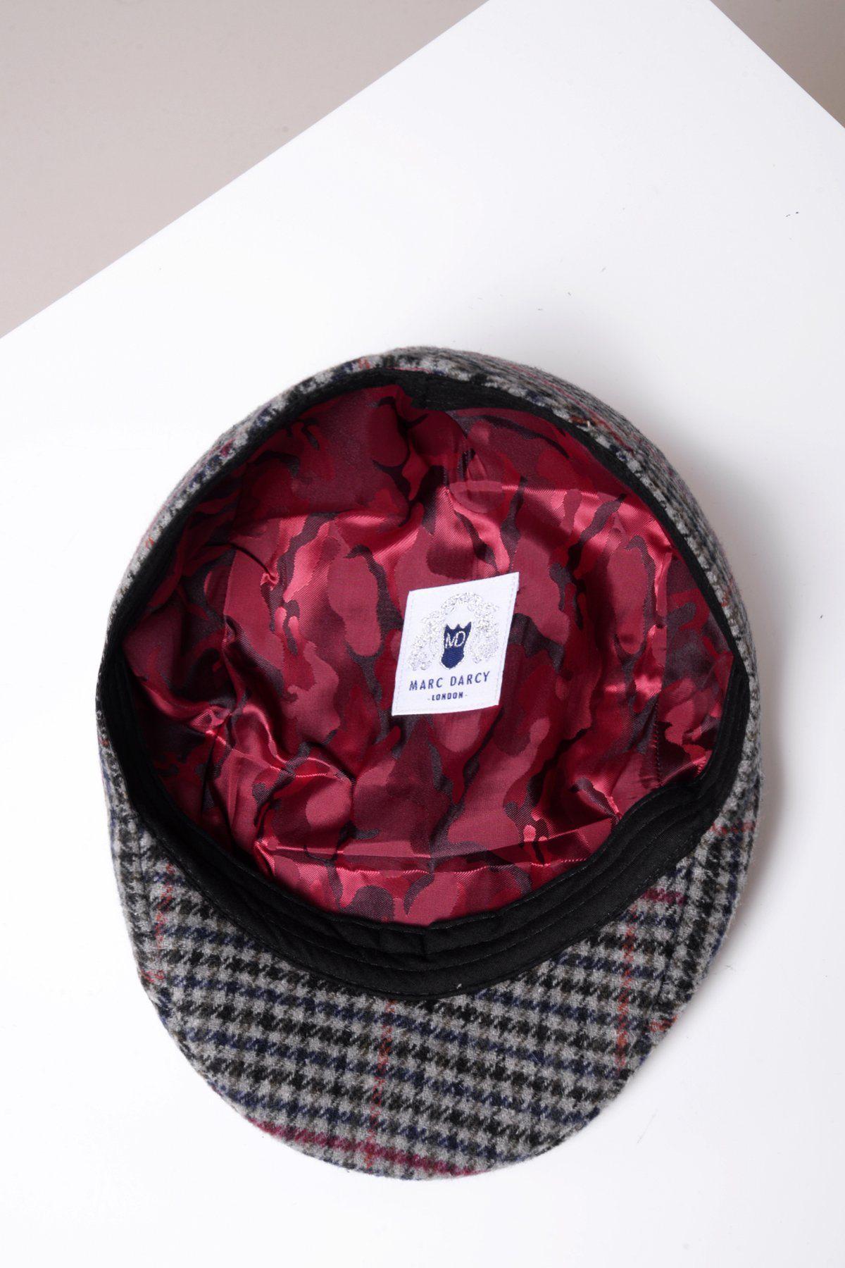 The Marc Darcy EDWARD flat cap features a navy grey check tweed, signature blue logo label, and red satin camouflage lining—a stylish Peaky Blinders-inspired accessory for any flat cap collection.