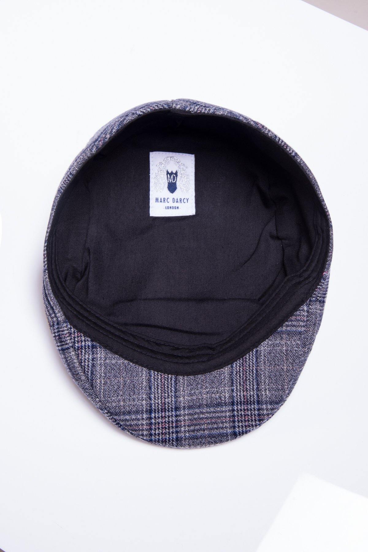The ENZO - Blue Grey Tweed Flat Cap by Accessory displays a grey and blue Prince of Wales check, black inner lining, and visible Marc Darcy London label, all presented on a white surface.