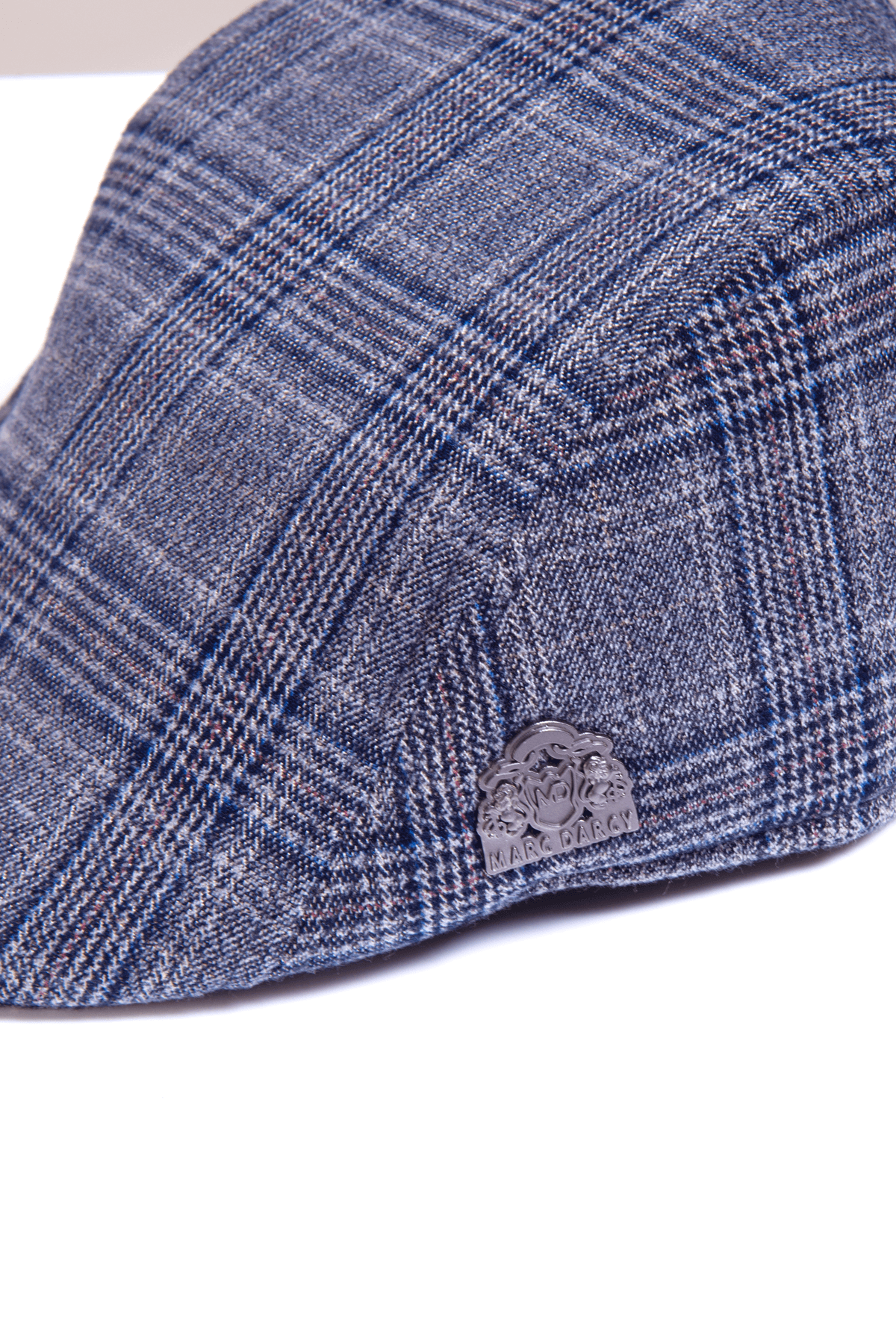 The ENZO Blue Grey Tweed Flat Cap by Accessory features a classic Prince of Wales check and a silver MARC DARCY logo on the side.