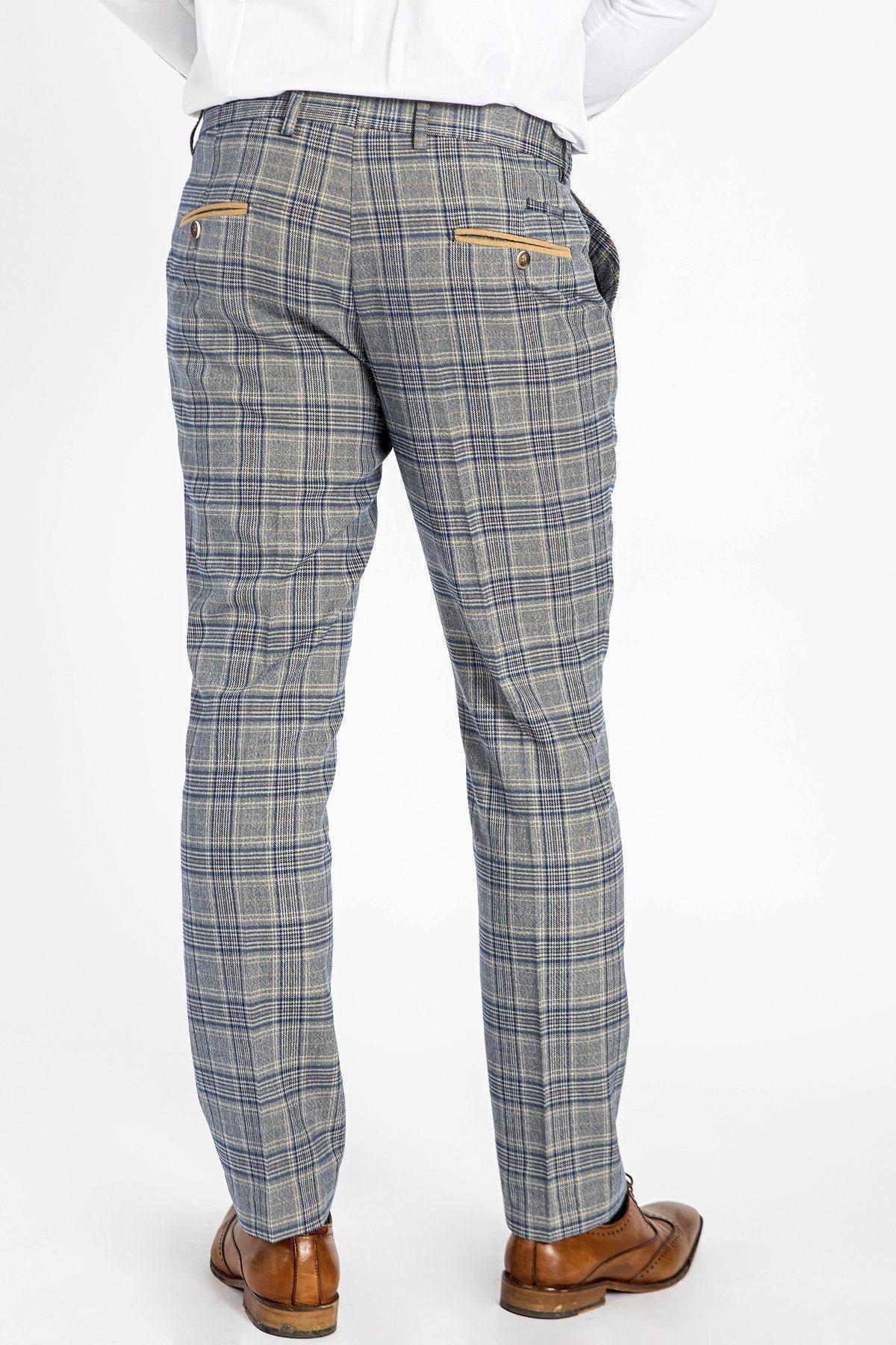 A person wearing marcdarcy ENZO Sky Stone Check Tweed Trousers and brown dress shoes stands with their back to a plain white background—a subtle nod to Peaky Blinders-inspired style.