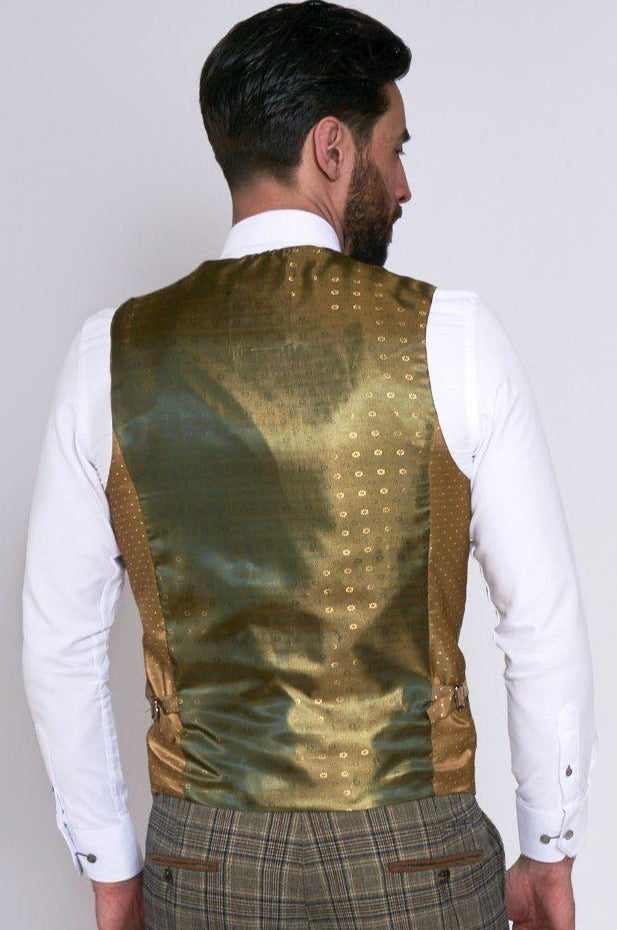 A man with dark hair and beard is seen from behind, wearing the marcdarcy ENZO Tan Check Tweed Single Breasted Waistcoat over a white shirt and Peaky Blinders inspired Prince of Wales check plaid trousers.