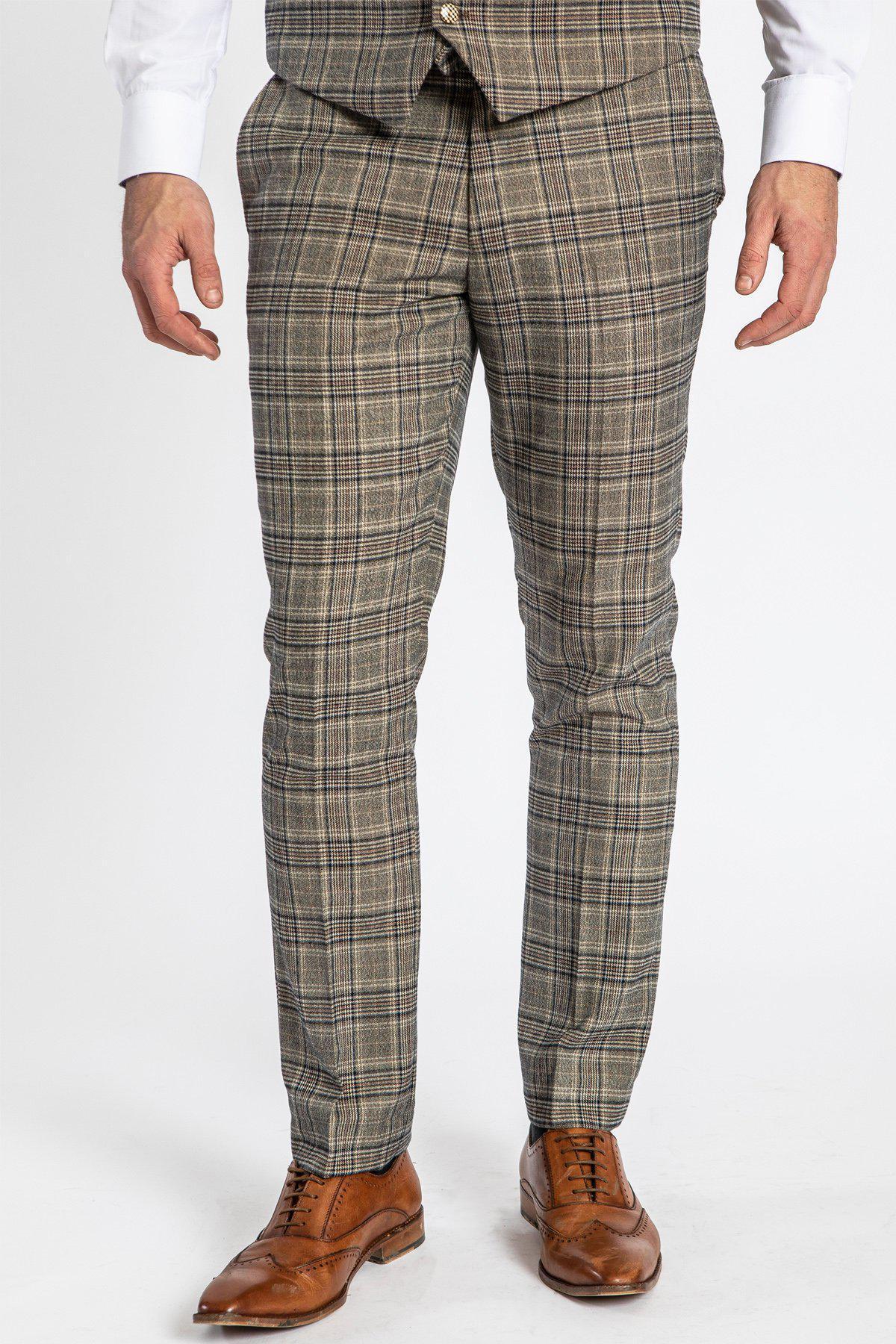 A person is shown from the waist down wearing marcdarcy ENZO Tan Check Tweed Trousers, a matching vest, white shirt, and brown leather dress shoes against a plain white background.