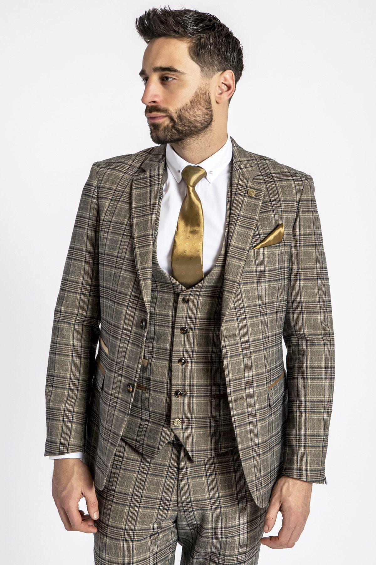 A man wears the ENZO - Tan Tweed Check Blazer by marcdarcy with a white shirt, gold patterned tie, and gold pocket square, styled against a white background.