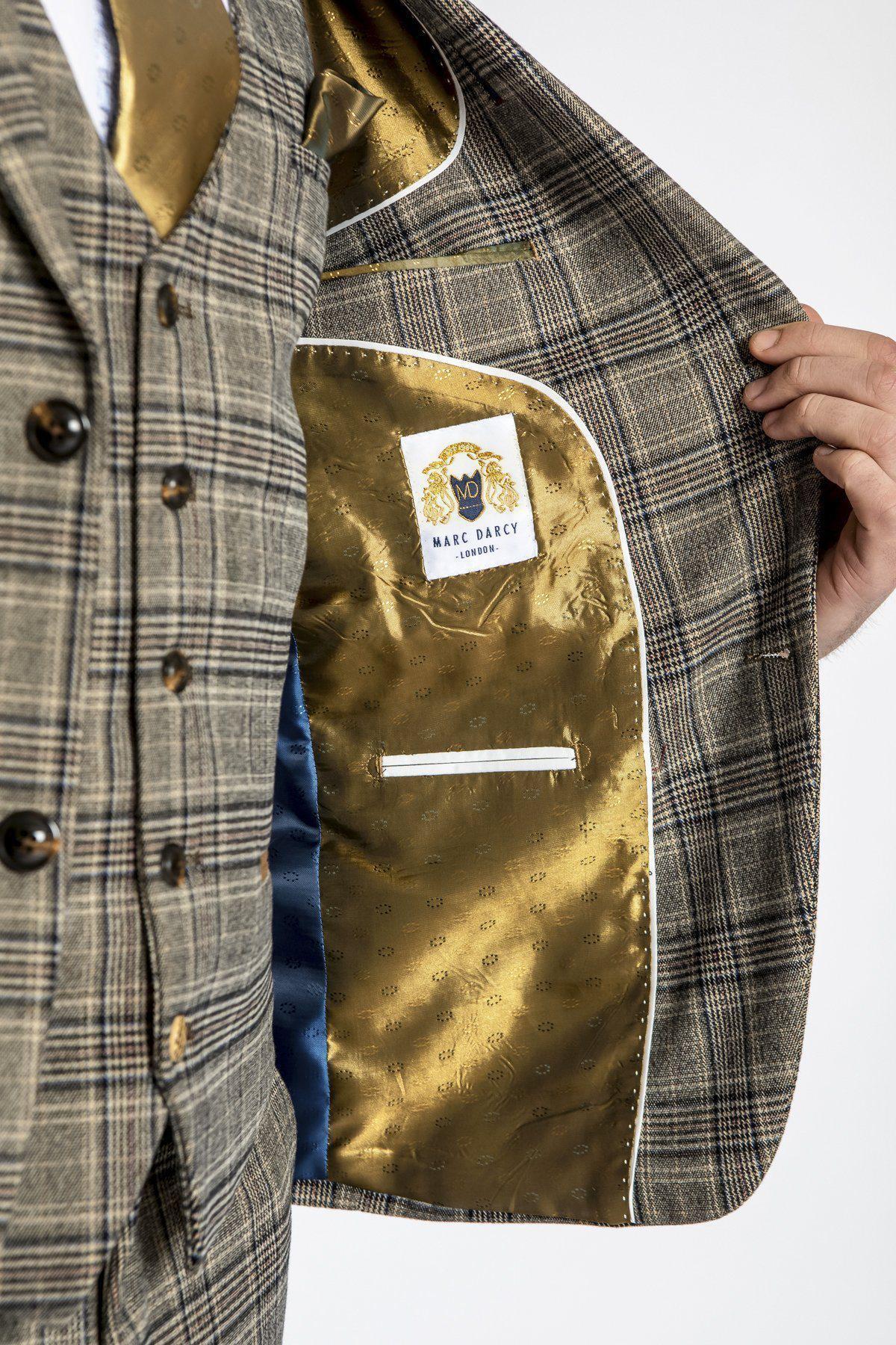Close-up of a man's tailored ENZO - Tan Tweed Check Blazer by marcdarcy, featuring a gold patterned lining and channeling the classic Peaky Blinders blazer style.