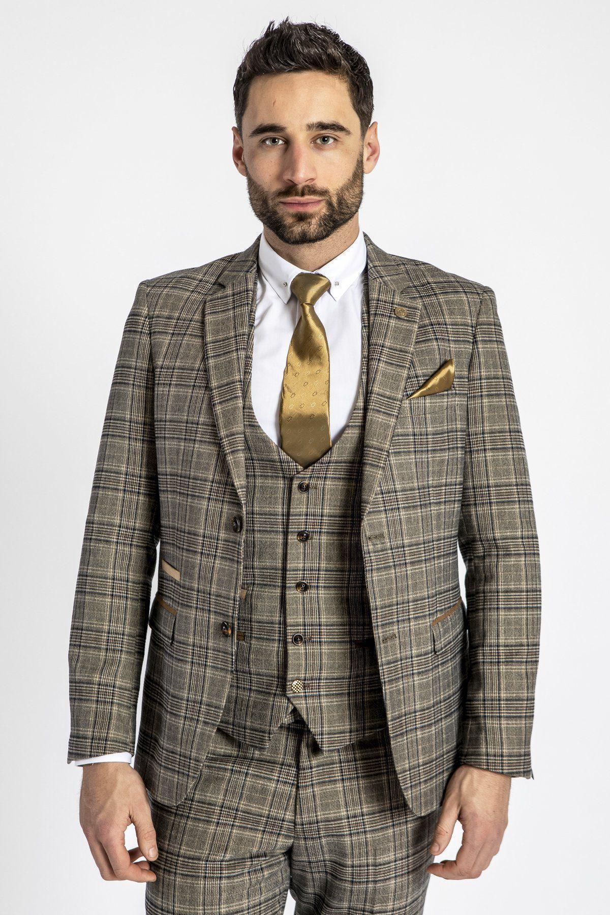 Man wears a marcdarcy ENZO Tan Tweed Check Blazer with a white shirt, gold tie, and matching gold pocket square.