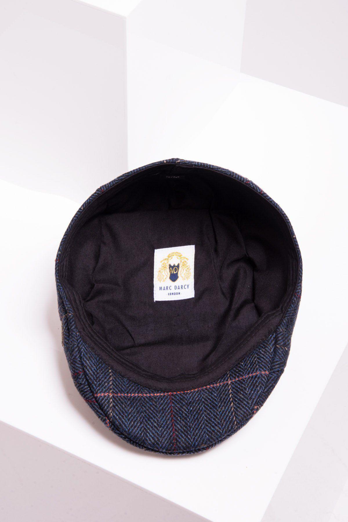 The ETON - Navy Blue Check Tweed Flat Cap by Accessory is shown upside down on a white geometric surface, revealing its black lining and an inner white Marc Darcy label.
