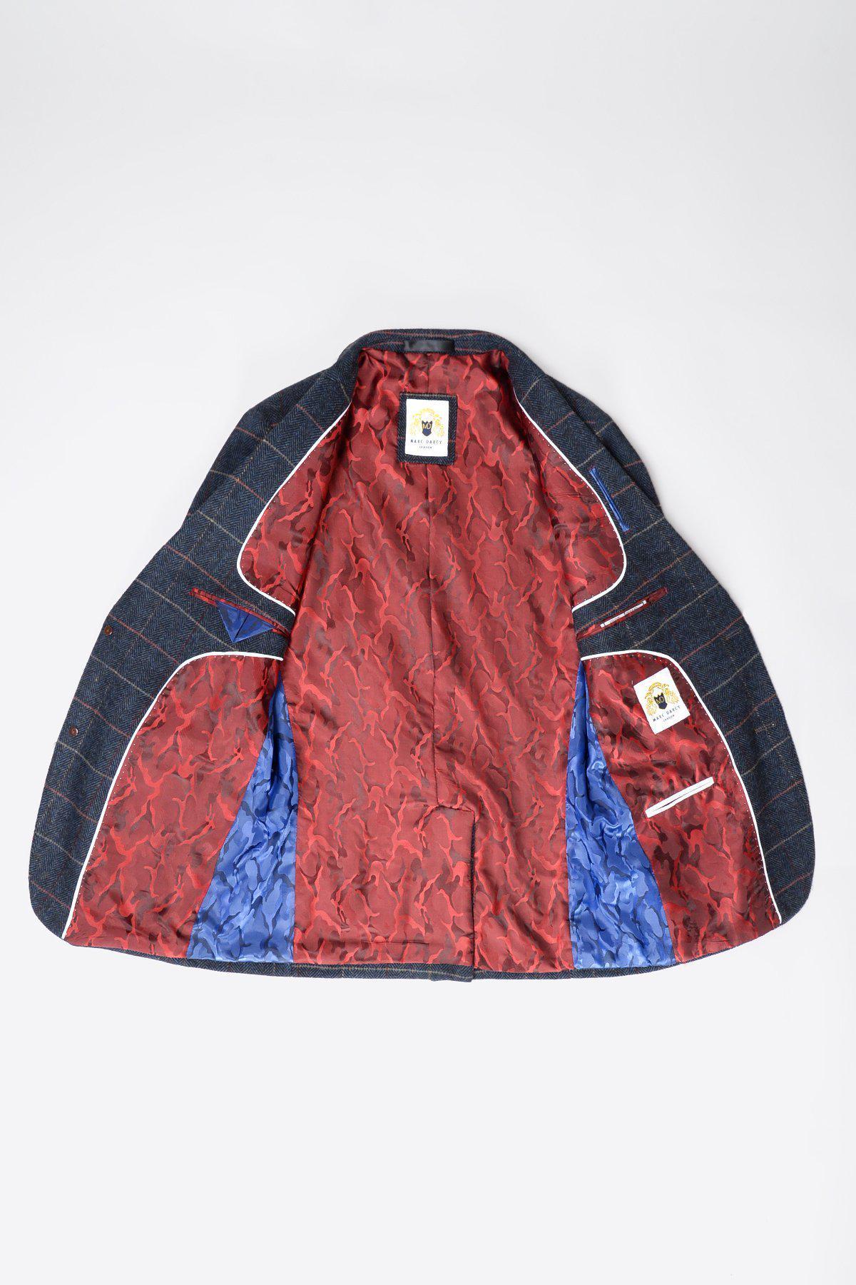 The marcdarcy ETON Navy Blue Tweed Check Blazer is shown open, revealing a vibrant red patterned lining with blue pocket accents and a white pocket trim. A neck label is visible, making it ideal for smart casual style.