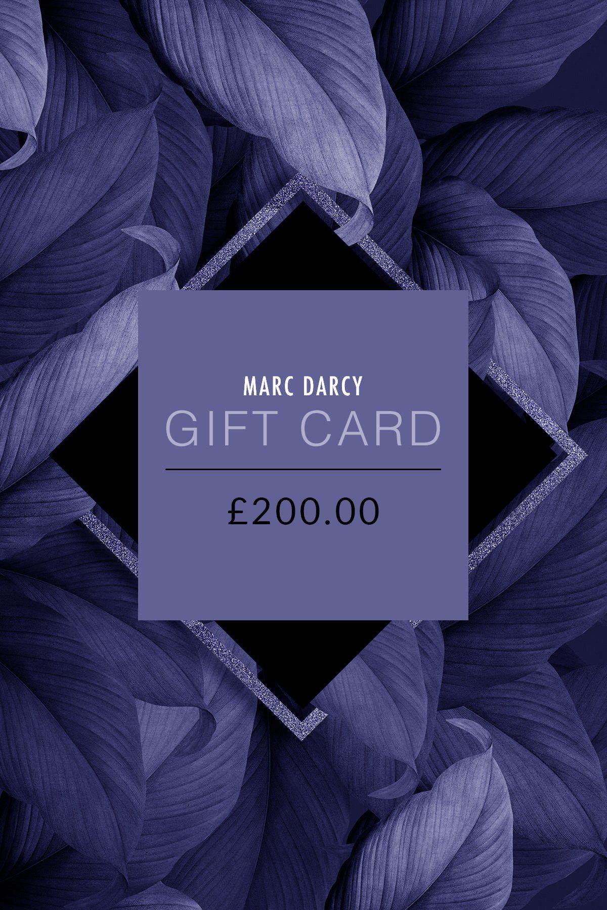 The Marc Darcy Gift Card - £200.00, the perfect choice for any occasion, is showcased on a backdrop of bold dark purple leaves with a geometric frame.