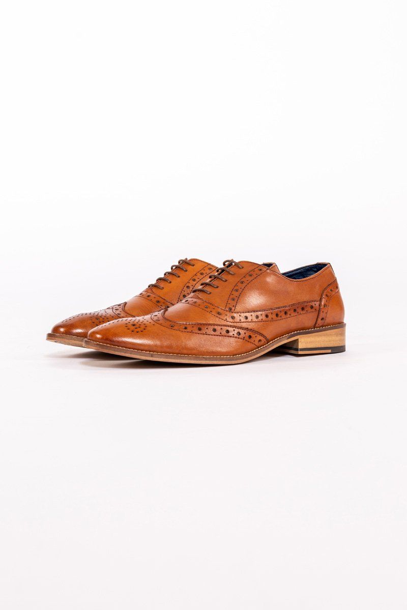 The GRAYSON - Tan Leather Wingtip Brogue Shoe by Marc Darcy features handcrafted detailing, decorative perforations, lace-up fronts, and light-colored soles, showcased on a white background.