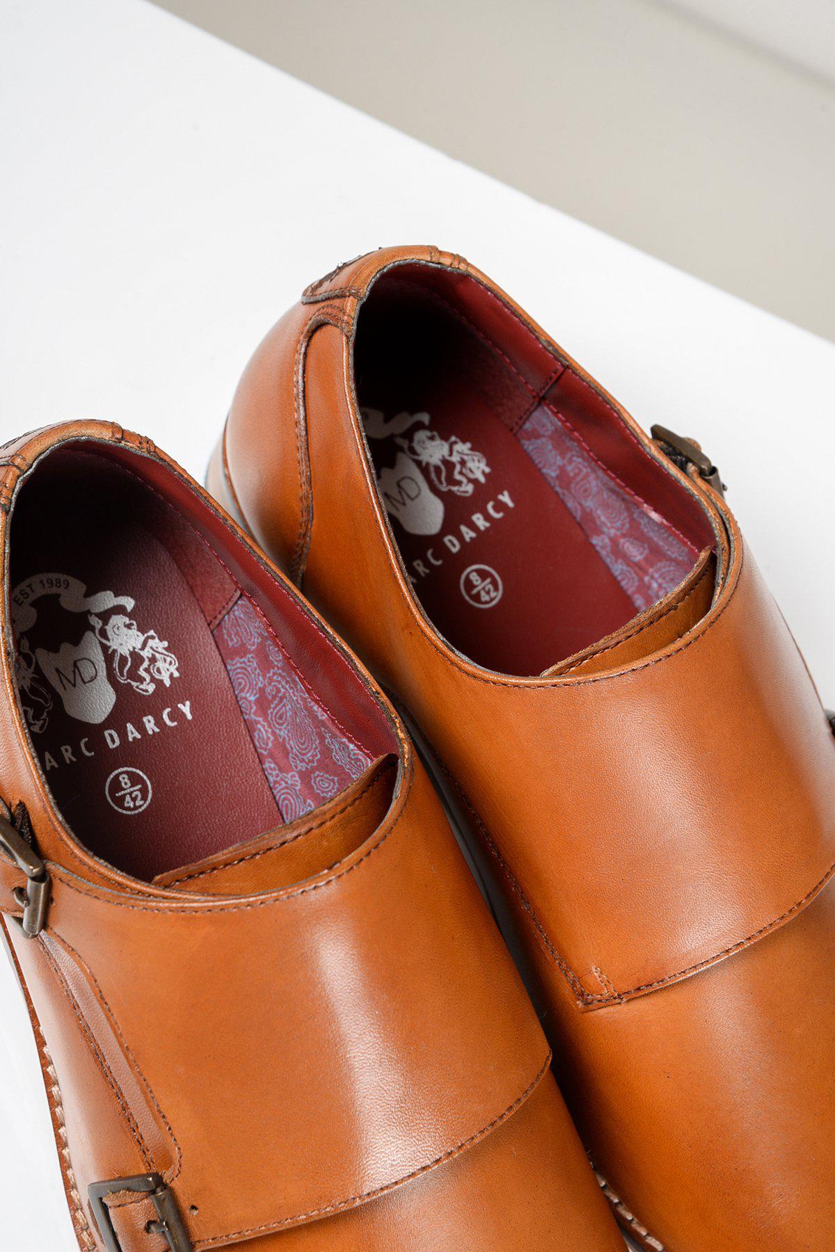 A close-up of two HARRIS tan leather double strap monk shoes by Marc Darcy, made from full grain leather with insoles featuring the Marc Darcy logo.
