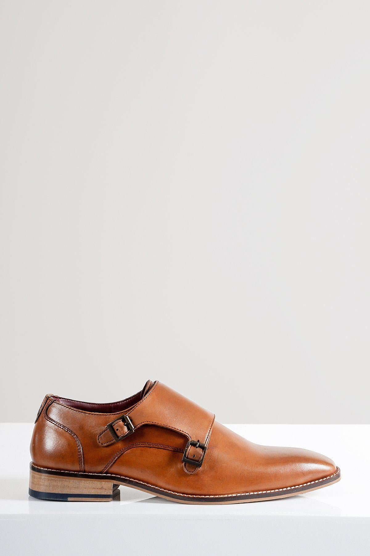 The Marc Darcy HARRIS is a tan leather double strap monk shoe featuring a pointed toe, dark buckles, and hand-stitched details.