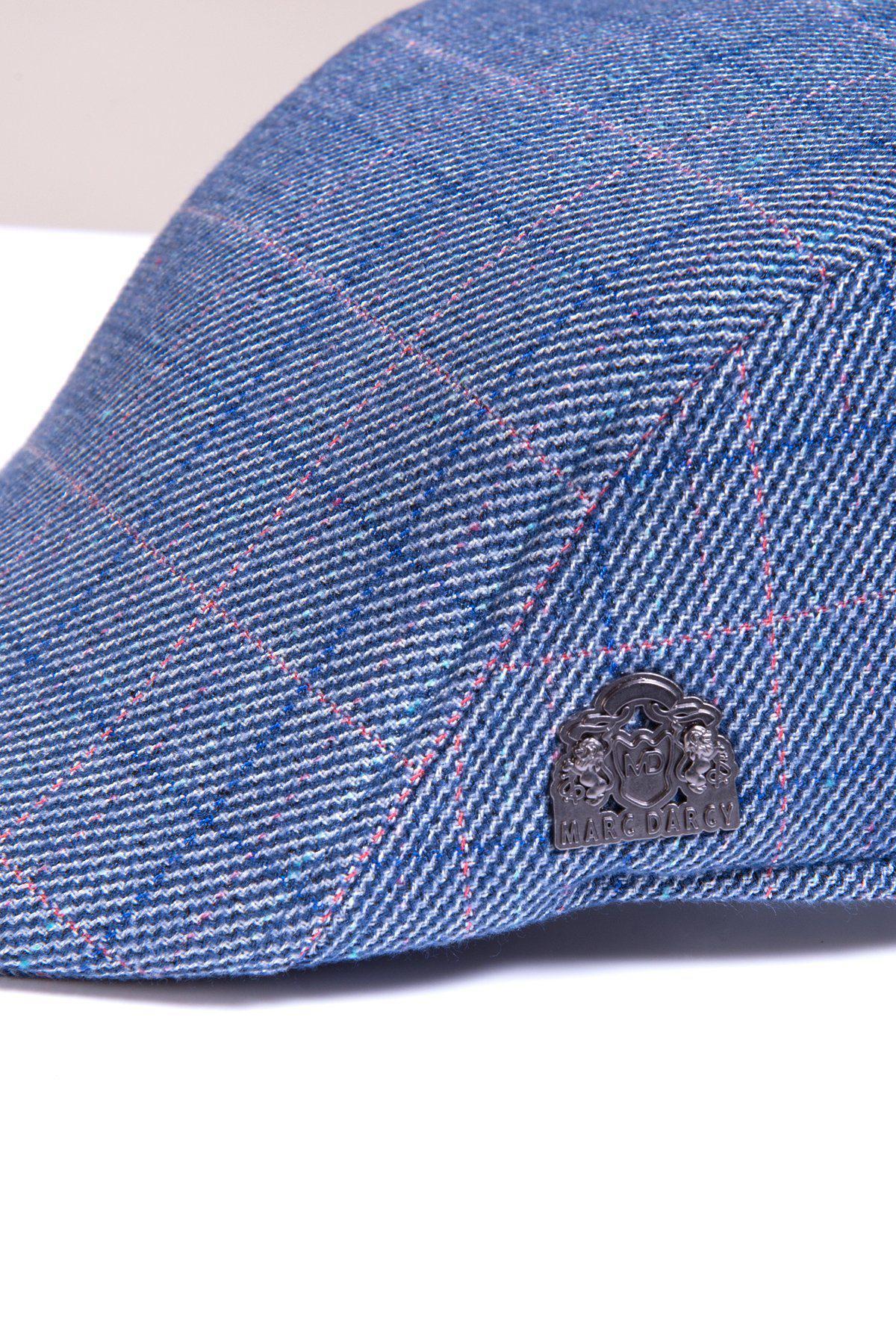 The HARRY - Blue Tweed Check Flat Cap by Accessory features a red and white plaid pattern in a vintage style, finished with a signature silver emblem.