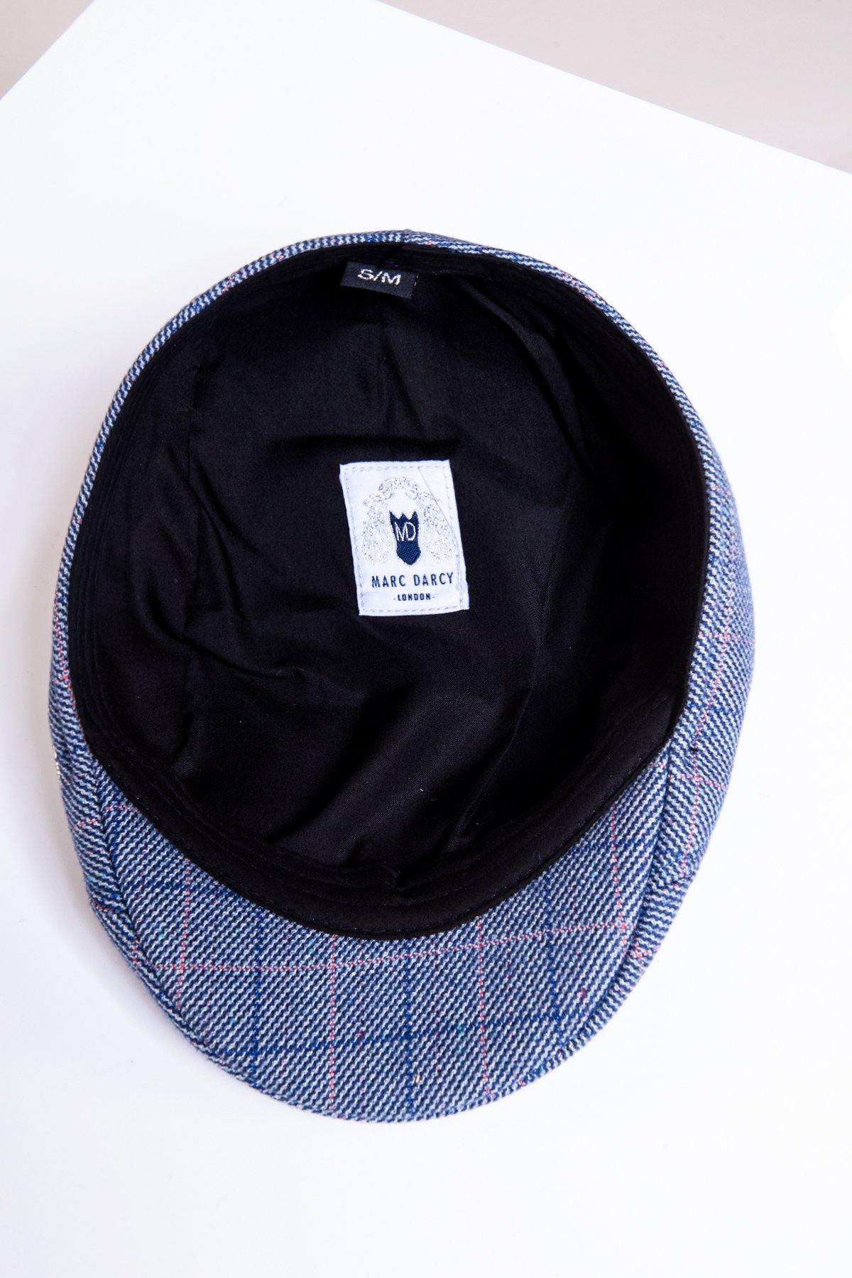 The HARRY - Blue Tweed Check Flat Cap by Accessory features a vintage blue, gray, and red check pattern. Shown inside out on a white surface, its inner label displays the brand and size S/M.