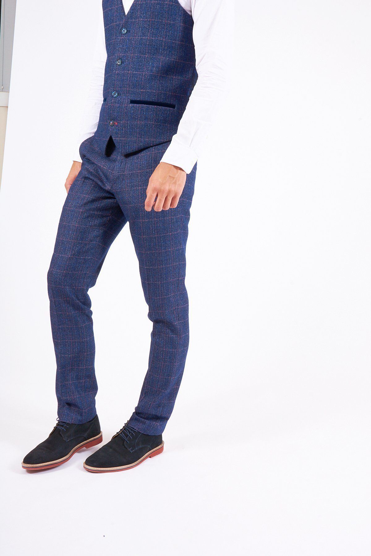 Man wearing marcdarcy's HARRY Indigo Tweed Check Trousers with a slim fit vest, white shirt, and black shoes—ideal for a sharp wedding look—posing against a white background.