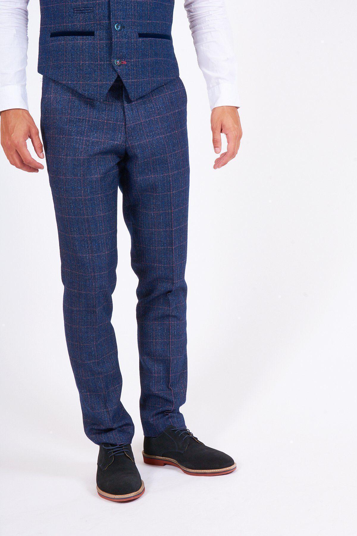 A man wears the marcdarcy HARRY Indigo Tweed Check Trousers, paired with a white shirt and black shoes against a white background—an ideal wedding look.
