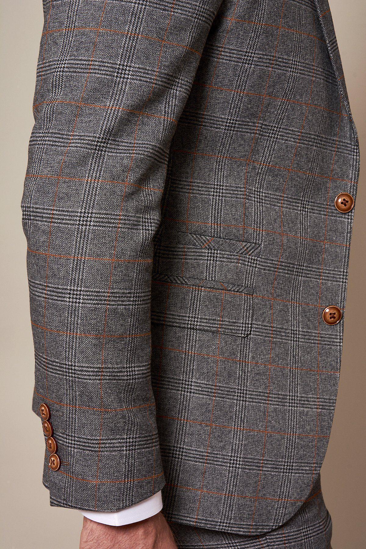 A close-up side view of the marcdarcy Sheffield Utd Collection Jenson Grey Check Suit, as worn by Billy Sharp, featuring a slim tailored fit with brown buttons and red lines, highlighting the sleeve and pocket against a neutral background.