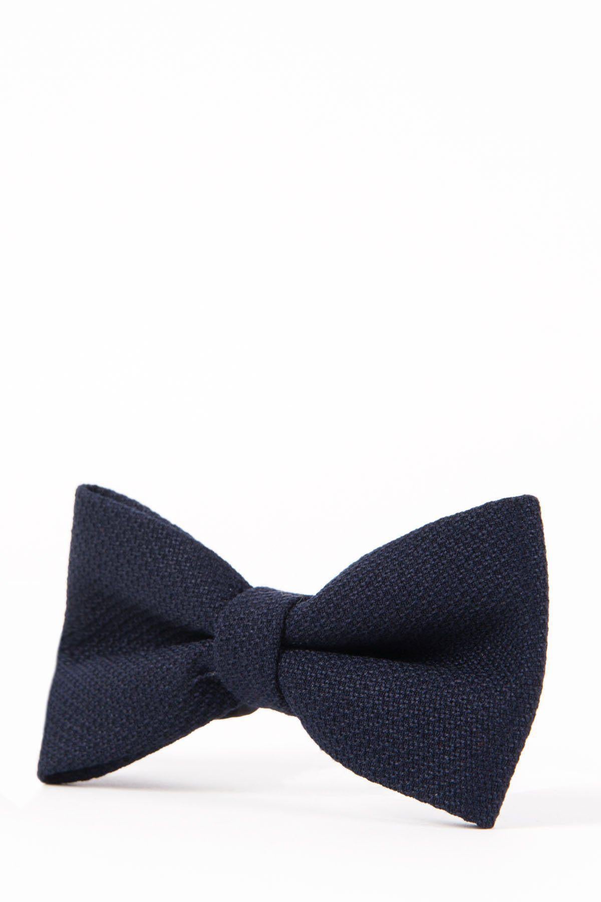 The Accessory JD4 - Navy Bow Tie, featuring a dark navy blue textured design, is displayed pre-tied against a white background.
