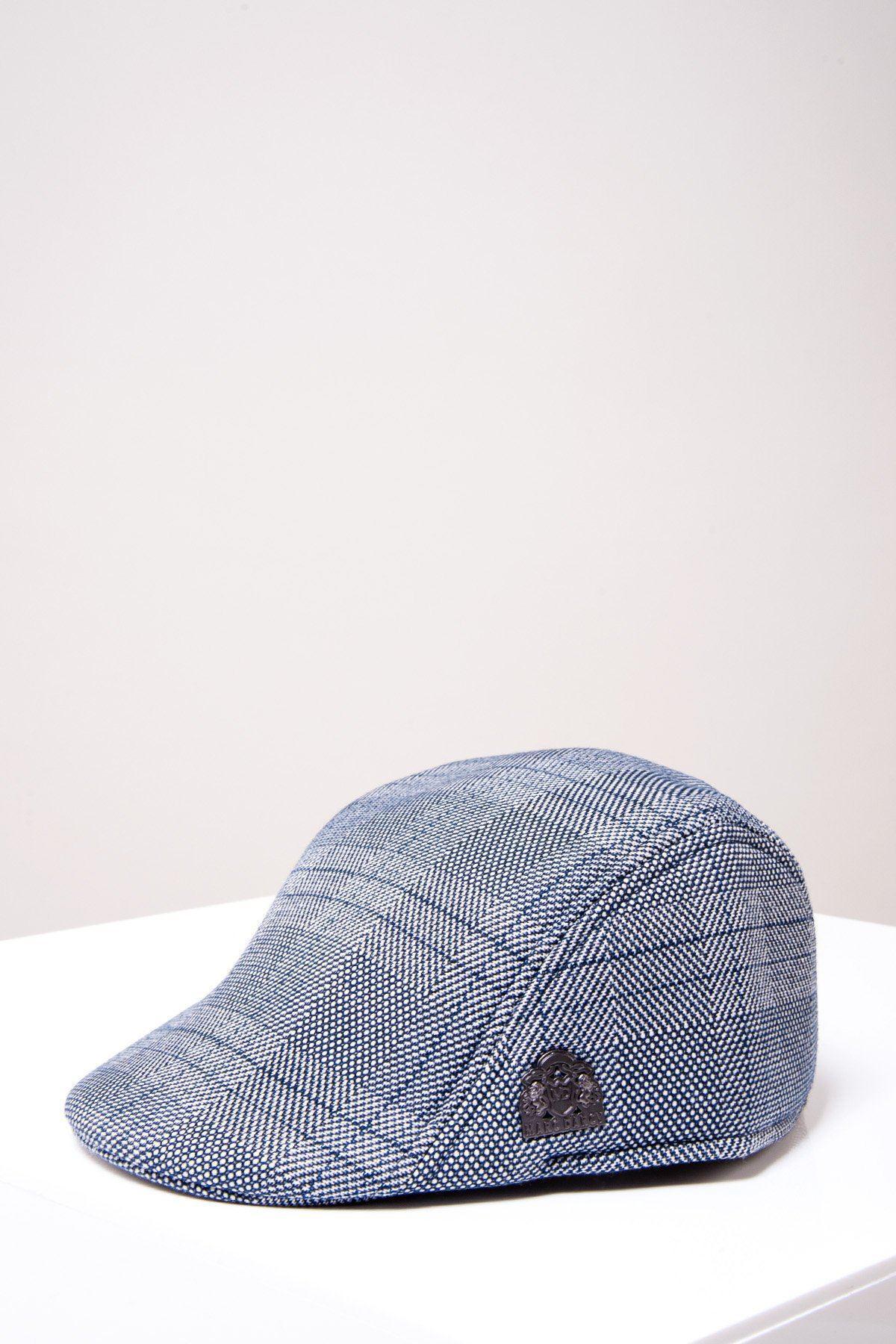 A grey check JERRY flat cap by Accessory, featuring a black emblem on the side, displayed on a white surface against a light gray background.