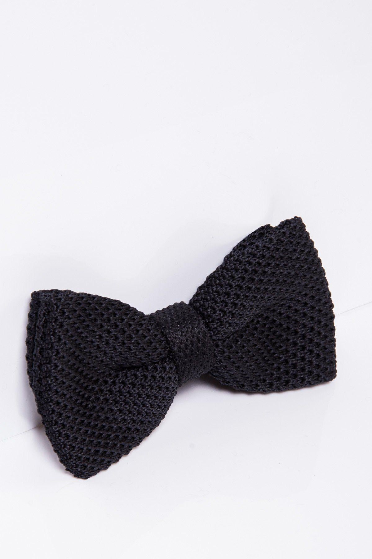 The marcdarcy KB - Knitted Double Layer Bow Tie In Black, featuring a rich texture, is shown at an angle on a white surface—an elegant accessory ideal for evening wear or wedding receptions.