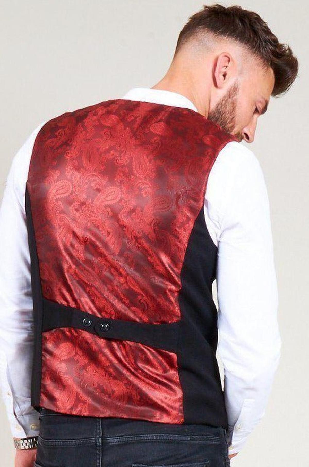 Back view of a man in a white shirt and the marcdarcy KELLY black double breasted waistcoat, featuring a slim fit and bold red paisley lining.