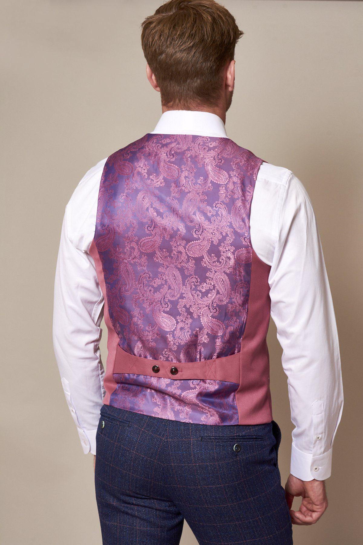 Back view of a man wearing a white dress shirt, navy plaid trousers, and the marcdarcy KELLY pink double breasted waistcoat.
