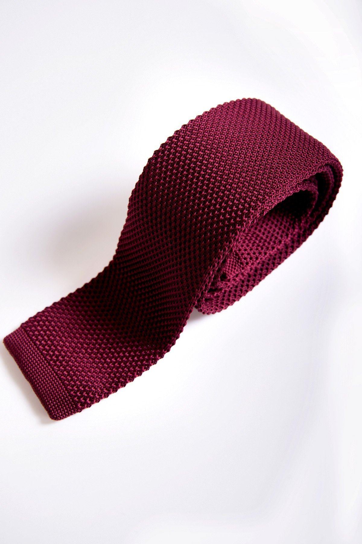 The Accessory KT - Wine Knitted Tie, featuring a modern textured design, is displayed rolled up on a white background.