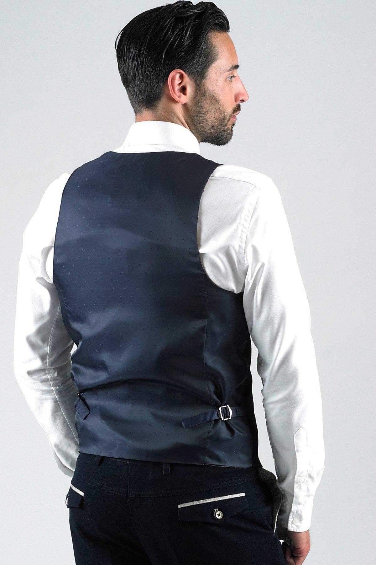 Man in a white dress shirt and marcdarcy LEE WILL-Denim Look Navy Waistcoat, viewed from the back.