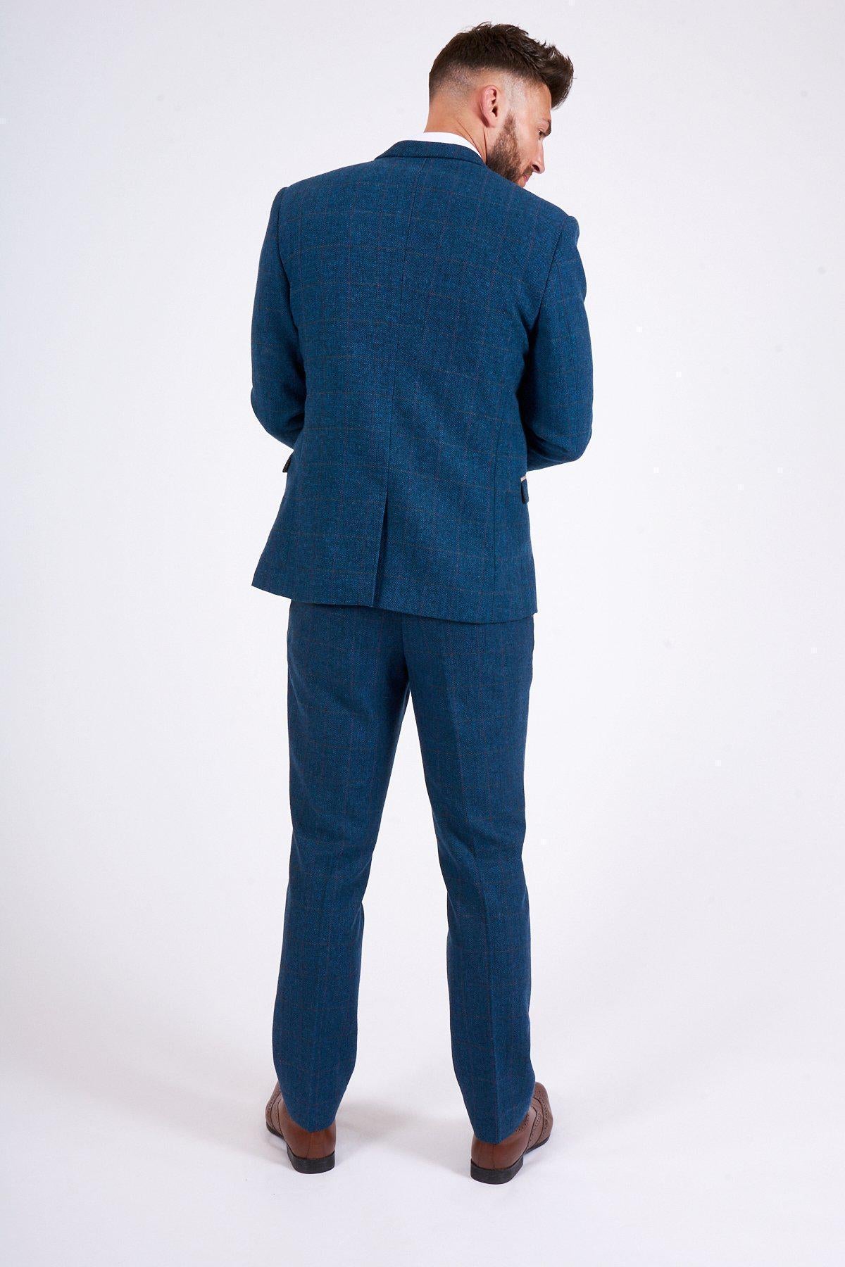 Fenerbahçe and Brazil midfielder Fred wears a marcdarcy Dion Blue Tweed Check Suit, standing with his back to the camera against a plain white background.