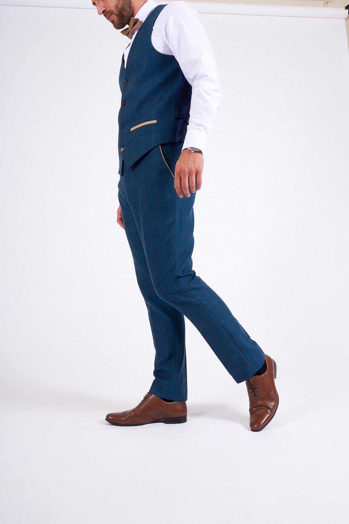Fenerbahçe and Brazil midfielder Fred wears a marcdarcy Dion Blue Tweed Check Suit against a plain white background. His head is slightly out of frame, and he sports a watch on his left wrist.