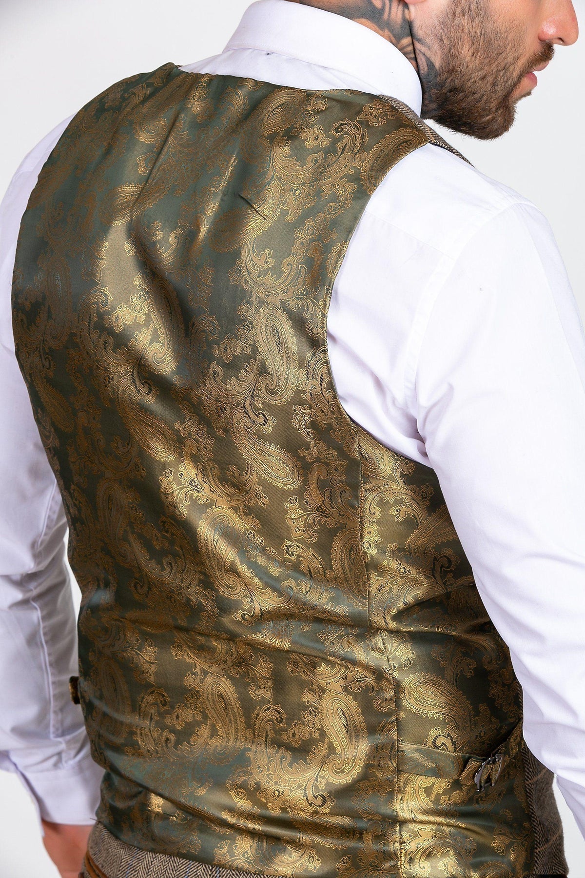 A man wears the marcdarcy MAX - Royal Blue Blazer with TED Waistcoat, shown from the back in a smart-casual look. His head is partially turned, revealing a neck tattoo and adding a unique edge to his style.