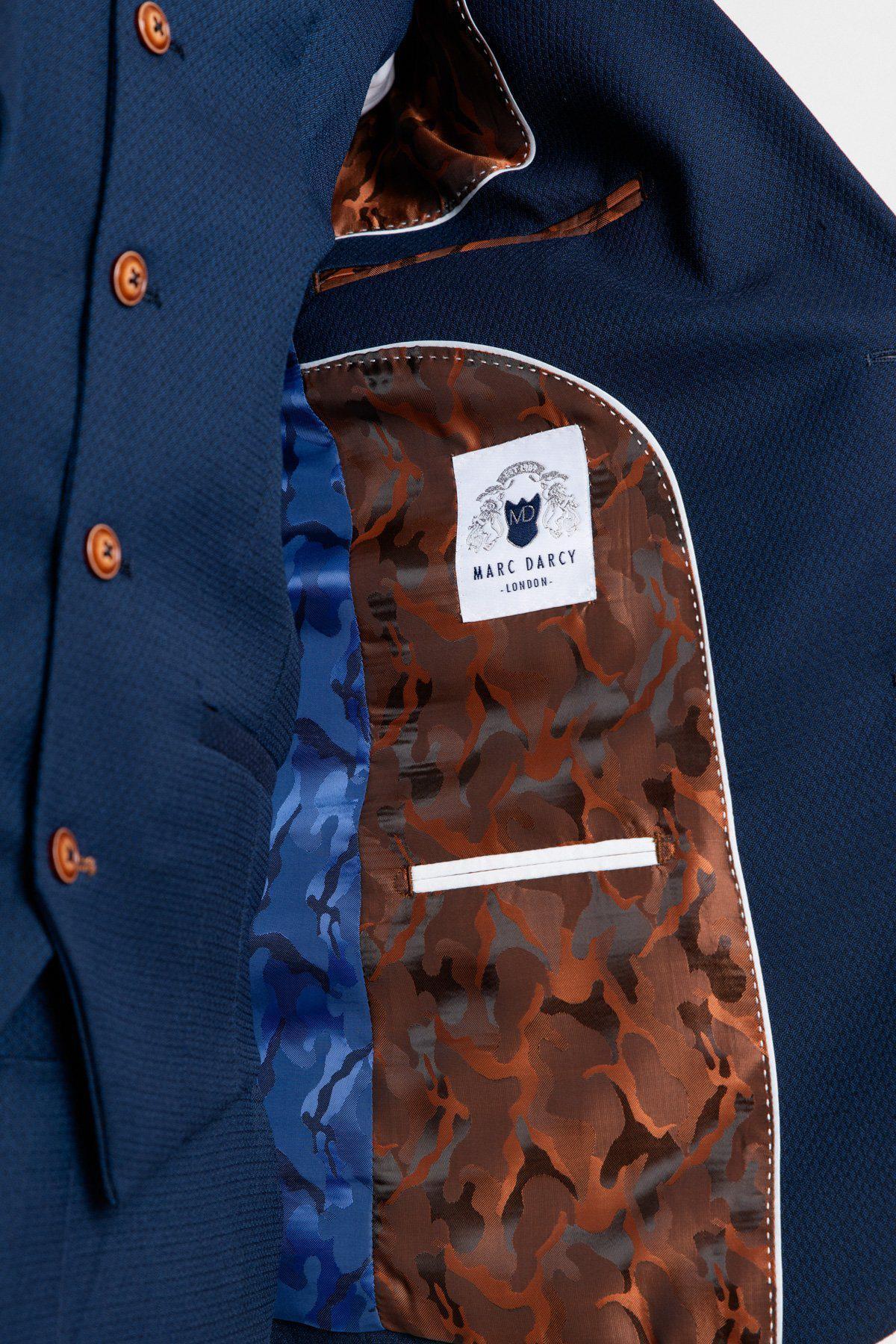 Close-up of The Everton Collection | Vitalii Mykolenko In The MAX Royal Blue Suit by marcdarcy, featuring brown buttons and a blue and brown camouflage inner lining with a stitched marcdarcy London label.