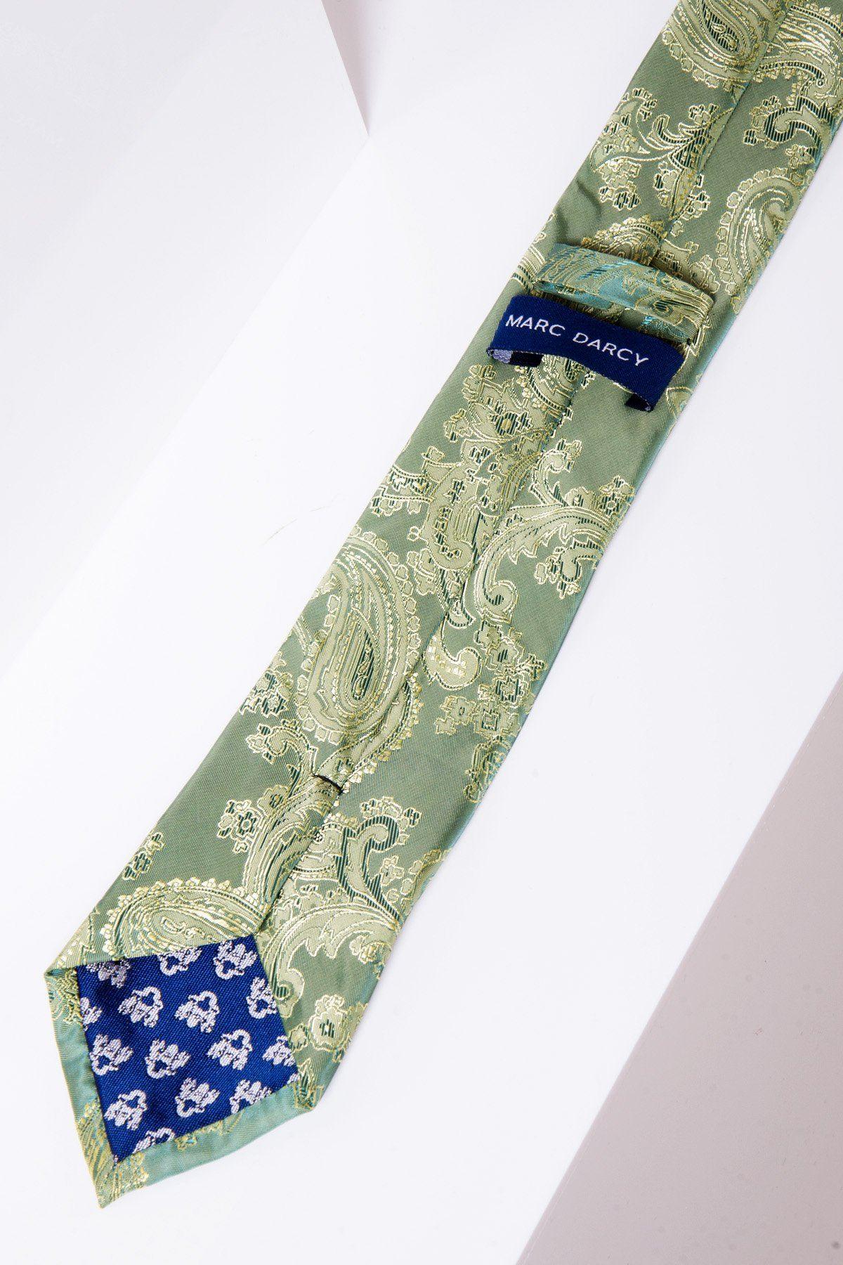 The MD PAISLEY Green Paisley Tie and Pocket Square Set by Marc Darcy features a green paisley tie with a blue “Marc Darcy” label and blue floral fabric under the tip—ideal for adding handmade elegance to formal outfits.