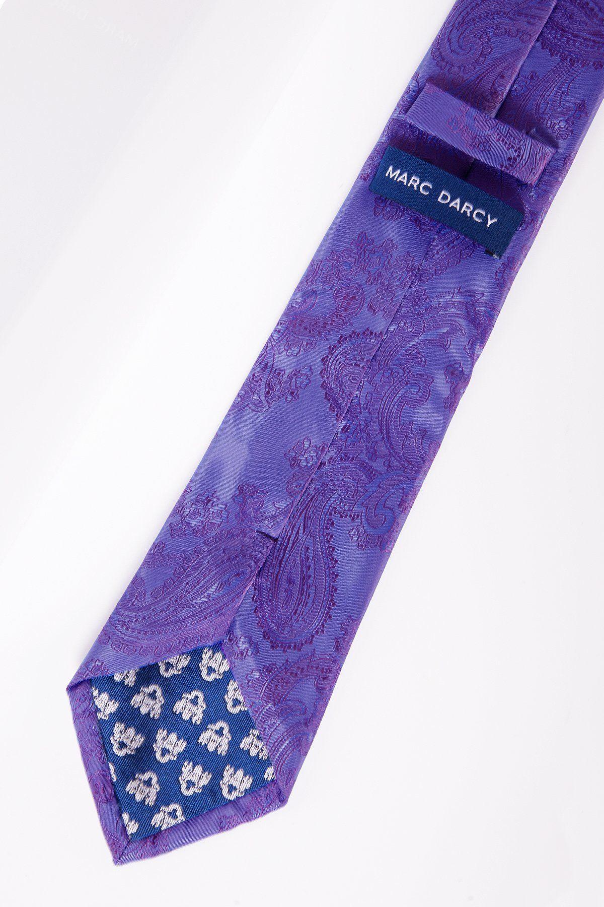 The PAISLEY - Lilac Paisley Tie and Pocket Square Set by Marc Darcy features a lilac paisley tie with a dark blue inner lining, white floral details, and the Marc Darcy label. Laid flat on a white surface, it’s an ideal formal accessory pairing.
