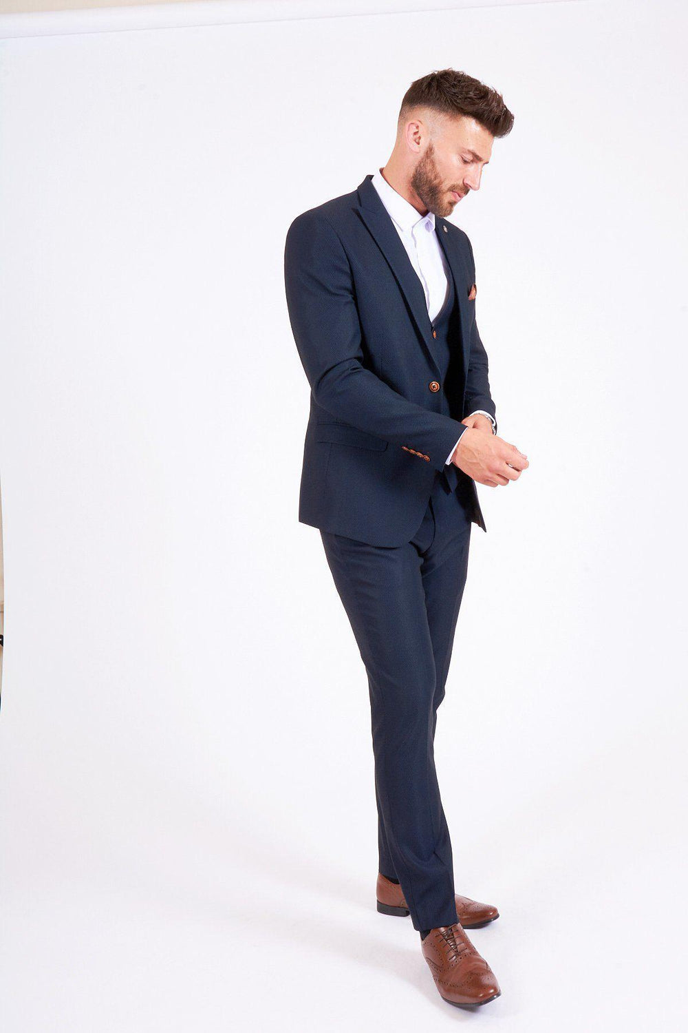 Man wearing men's PSG Footballer Ander Herrera in Max Navy Suit- Marc Darcy Menswear